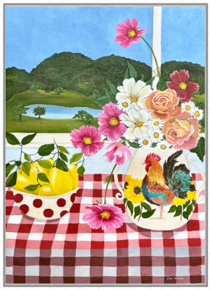 still life scene featuring a vase with a rooster filled with pink and white cosmos and orange roses next to a bowl with red spots filled with lemons, against a hinterland inspired landscape window view backdrop and a red gingham table cloth