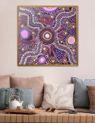 Aboriginal art that talks about connecting with the land. Purple, red and pink colours are used in this piece. 