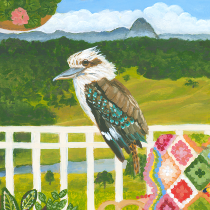 Kookaburra sitting on a verandah fence against a landscape backdrop inspired by the Sunshine Coast hinterland. Including plants and a cosy chair with colourful crochet blanket in the forecground.