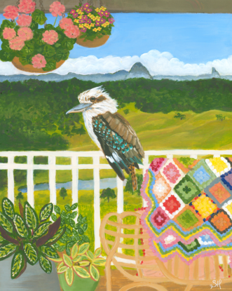 Kookaburra sitting on a verandah fence against a landscape backdrop inspired by the Sunshine Coast hinterland. Including plants and a cosy chair with colourful crochet blanket in the forecground.