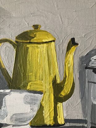 four vintage objects sit on a mid grey surface. A small white bowl, a yellow enamel coffee pot, a lidded white enamel canister and a taller olive green bottle. the background is a light grey