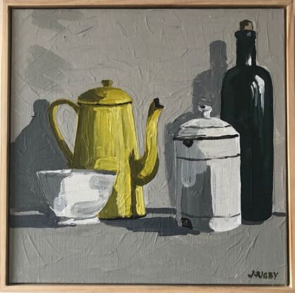 four vintage objects sit on a mid grey surface. A small white bowl, a yellow enamel coffee pot, a lidded white enamel canister and a taller olive green bottle. the background is a light grey