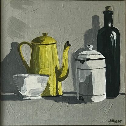 four vintage objects sit on a mid grey surface. A small white bowl, a yellow enamel coffee pot, a lidded white enamel canister and a taller olive green bottle. the background is a light grey