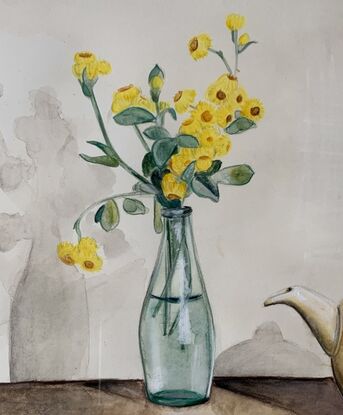 Yellow buttons (native Australian flowers) in an old lemonade bottle to the left of a Clarice Cliff teapot.