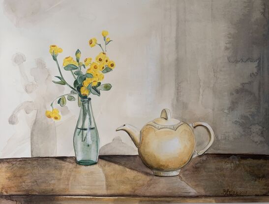 Yellow buttons (native Australian flowers) in an old lemonade bottle to the left of a Clarice Cliff teapot.