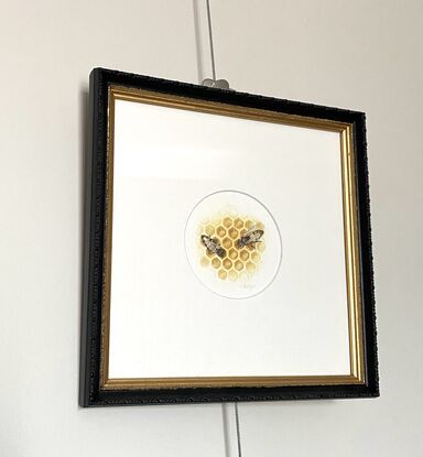 A honey bee on honeycomb, painted in watercolour.