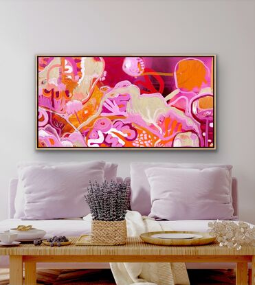 Bright colours in floral shapes depicting a landscape, reds, oranges and pinks 