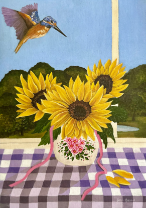 vase of 3 sunflowers on a purple gingham table cloth against a window view hinterland inspired landscape scene