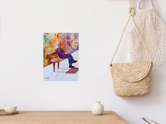 An artwork showing a man sitting on a high street bench waiting patiently for a bus. 