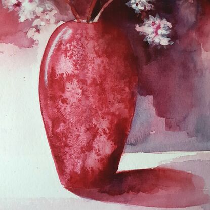 red, pink and white flowers in a red vase with long shadows