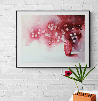 red, pink and white flowers in a red vase with long shadows