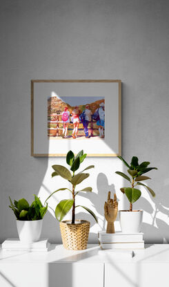 An artwork showing a group of girls leaning on a fence looking at the view whilst out hiking. 