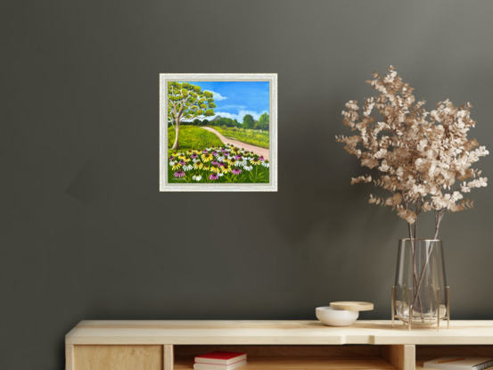 field of wild cosmos against a hinterland landscape scene featuring a path, a eucalyptus tree and a view of the glass house mountains 