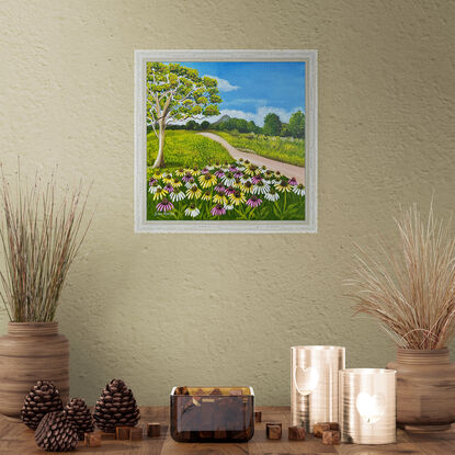 field of wild cosmos against a hinterland landscape scene featuring a path, a eucalyptus tree and a view of the glass house mountains 