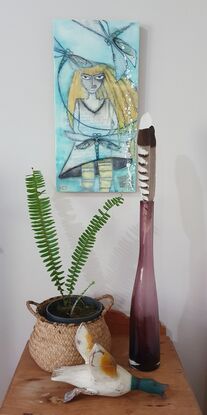 Encaustic art depicting yellow haired girl with dragonflies swirling about her