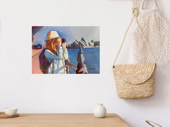 An artwork showing a woman photographing buildings across Sydney Harbour.
