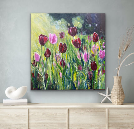 Glowing dark red tulips and bright pink tulips dancing in a breeze with the sun shining behind them and gently caressing the petals and stalks. This is a happy calming painting that warms your heart and will bring nature and positivity into your home. Captured moments of beauty untouched and glowing with light. 

This is an artwork with impact and statement and would be enhanced with a natural wood frame to add interest and beauty to your home however it is finished around the sides and ready to hang without the expense of a frame. 