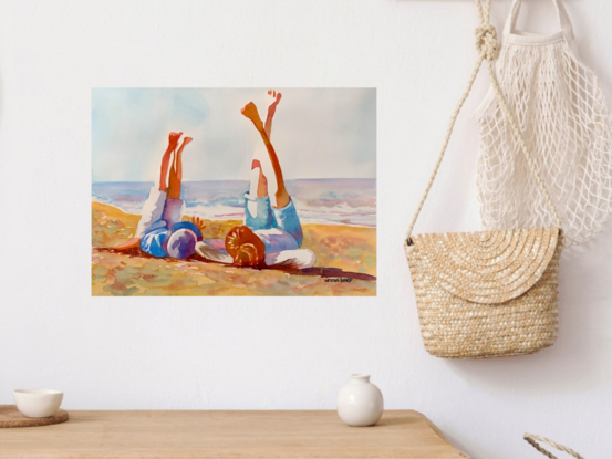 An artwork showing a mum and her son lying barefoot with their legs in the air relaxing on the white sands of a sunny beach.