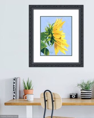 yellow sunflower green leaves blue sky