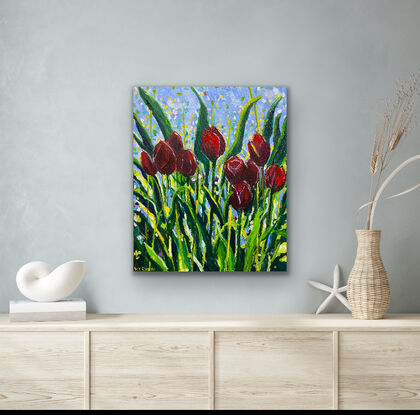 Brilliant dark red tulips sparkling with light in a field of dancing leaves. This is a slightly stylised and modern interpretation of a field of flowers that is unique and eye-catching. There is a transparency to some of the beautiful petals which intensifies the impression of light. The artwork has a playful feeling with its styled leaves and happy sparkles of colour. 