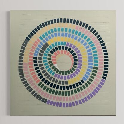 Cream  background, vibrant lines of rainbow making up a circular shape 