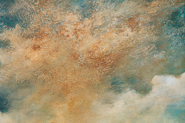 Dramatic  highly textured blue and ochre cloudscape over peaceful blue sea.

