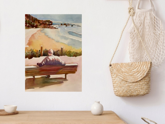 An artwork showing an elderly man sitting on a bench at a lookout over the white sands of a sunny beach .