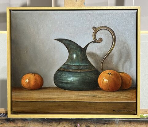 Antique brass jug and mandarins