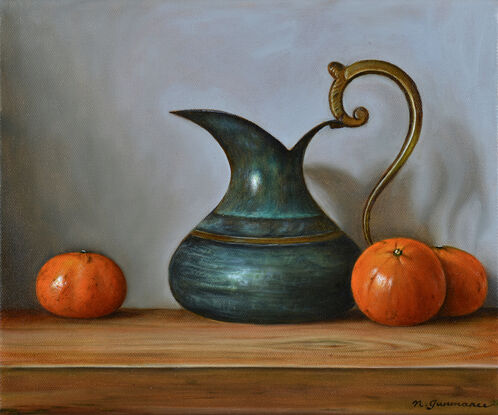 Antique brass jug and mandarins