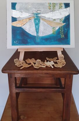 small oil painting of dragonfly flying over full moon background