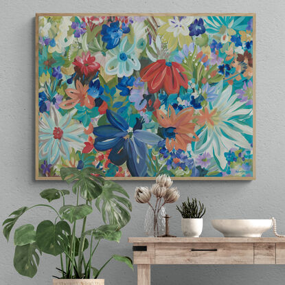 Modern colourful abstract canvas print of an modern blue tropical flowers  in a style of expressionist landscape with warm red and blue tropical flowers in bloom