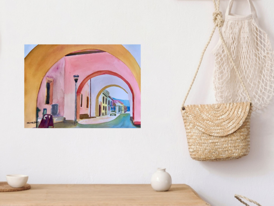 An artwork showing an arched passageway onto a quiet street beyond.