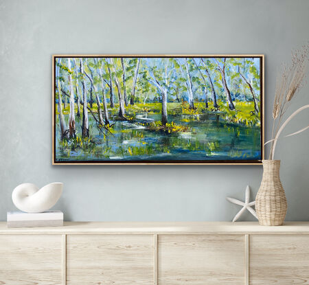 A quiet flood plain or wet lands with the intense colours from the first rains. The trees stand tall and regal as though standing guard over the land. A peaceful water scene of untouched beauty that can be found in pockets around the rivers of Australia. 