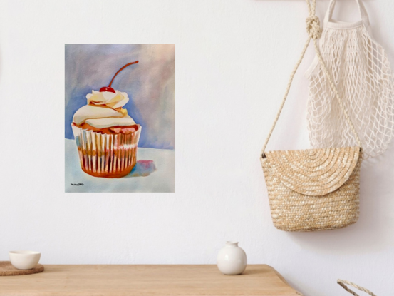 An artwork showing a cupcake with a cherry on the top.