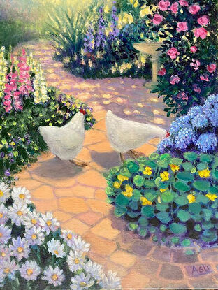 White hens on a garden path