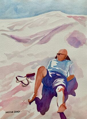 An artwork showing a man lying at rest on a scorching hot sand dune.