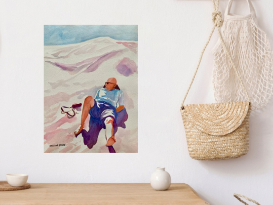 An artwork showing a man lying at rest on a scorching hot sand dune.