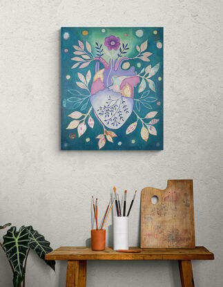 Original artwork by artist Libby Mills. A mixed media painting of a human heart. Vibrant in colour with teals, purples, pinks, orange and more.  Floral patterns with leaves coming out of the heart in a patchwork/ illustrative manner.