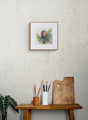 A dried banksia flower with foliage