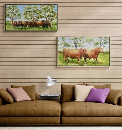 Two red angus bulls in a field.