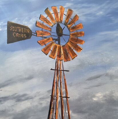 Rusty Windmill in  Australian outback and grass bird