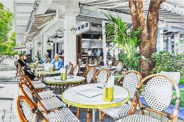 This busy,  cafe corner in Hastings Street with typical French cafe chairs lined on  the footpath and shadowed by large green poincianas has attracted tourists and locals for their morning coffee for many years.  A few locals are seated before the rush enjoying their first coffee of the day.  Internal lighting with chandeliers  define the internal dark walls and drink cabinets behind  and provide a sophisticated tonal  ambience. 