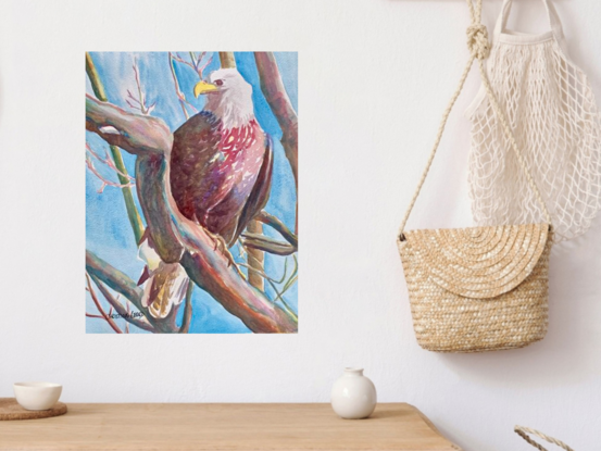  artwork showing a bald eagle standing on a branch
