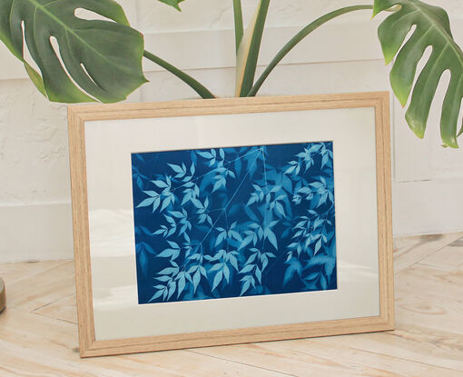 Image of branches of privet leaves in varying shades of blue. It is technically a photo but has the texture of a painting.