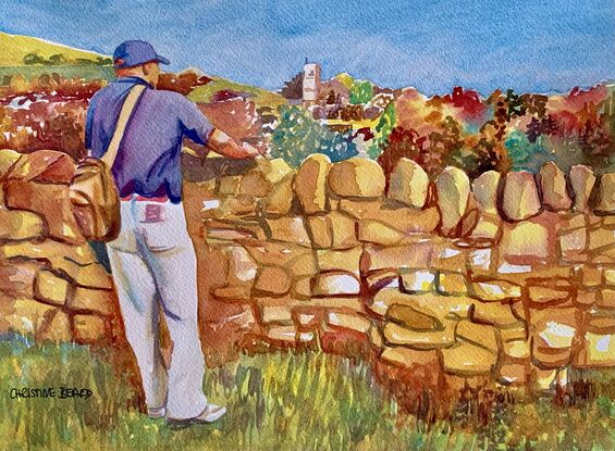 artwork showing a man leaning on a dry stone wall looking at a distant church 
