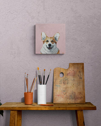 Smiling corgi dog painted on a smallish square pink canvas