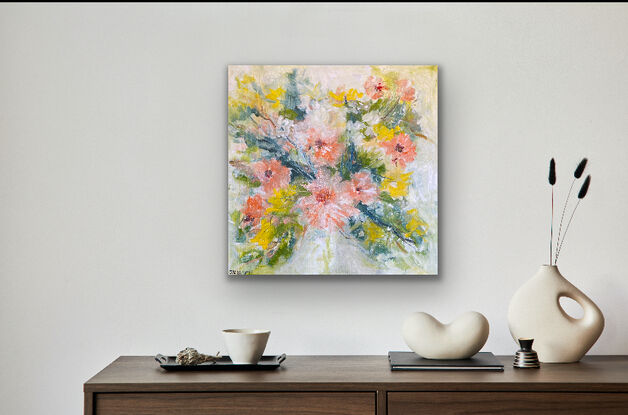 A light filled piece with very soft green tones in the background and a riot of soft peach toned flowers and yellow and white complementary flowers that ramble over the canvas. There is a delicate soft feel to this art as the flowers emerge with energy and in all their vibrant tones. This is a heartwarming piece to catch your eye. 