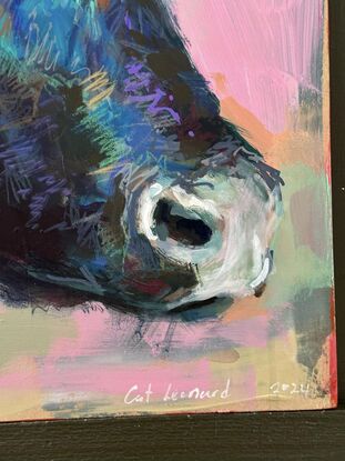 An original mixed media painting of a cow's head, painted in lively colours and an expressive mark making style, on board ready to hang with wire fastened to the back. 