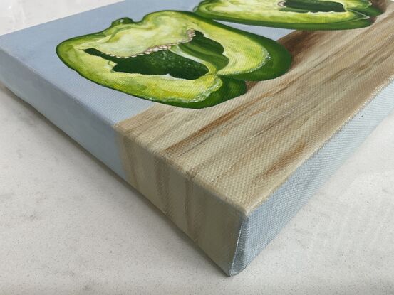 Capsicum halves on wooden surface 