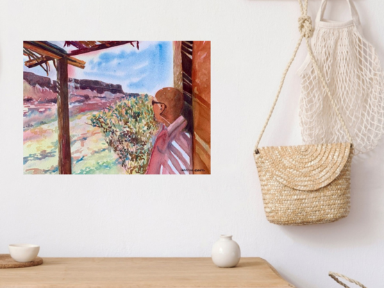 artwork showing a man standing in the strawy shade of a rustic patio looking out at the view
